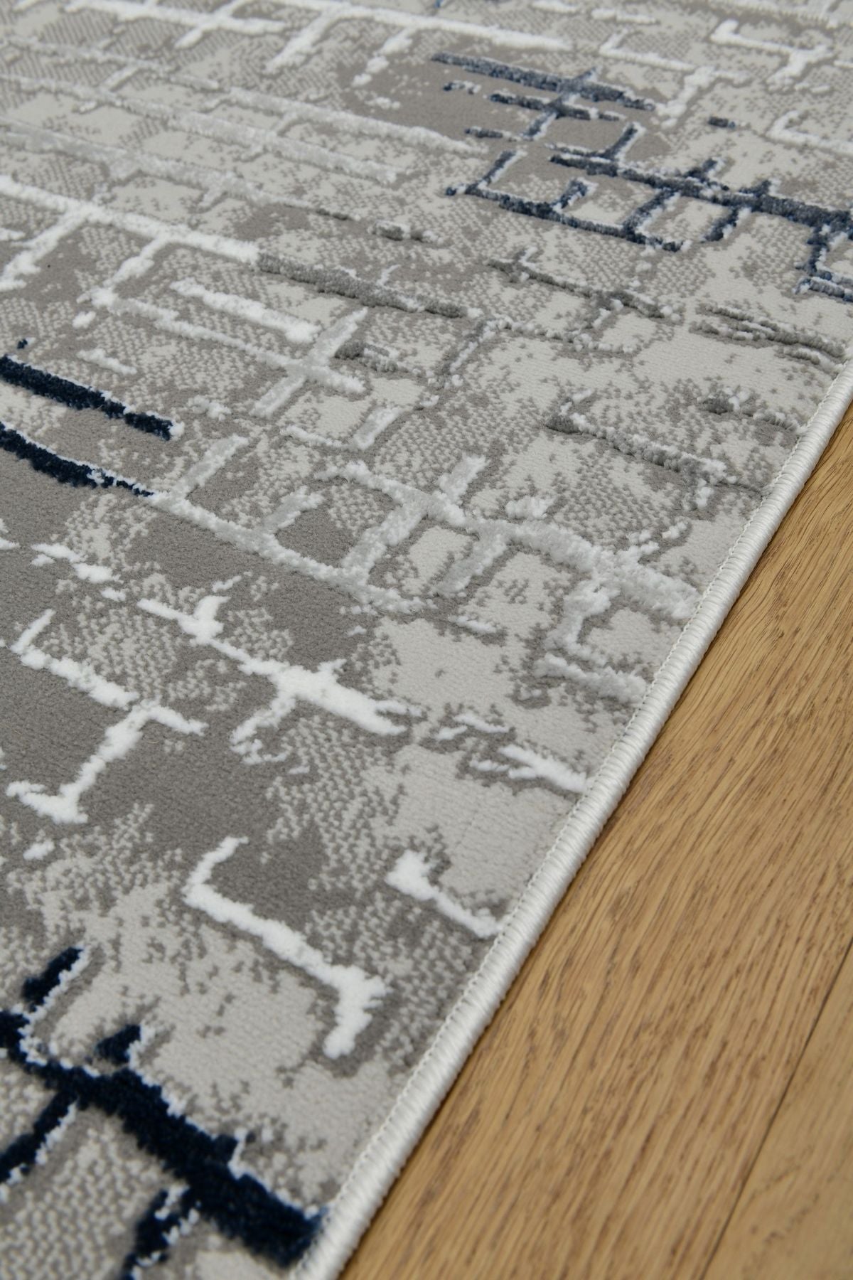 Astra GrafitBlå – Urban struktur i modern tappning