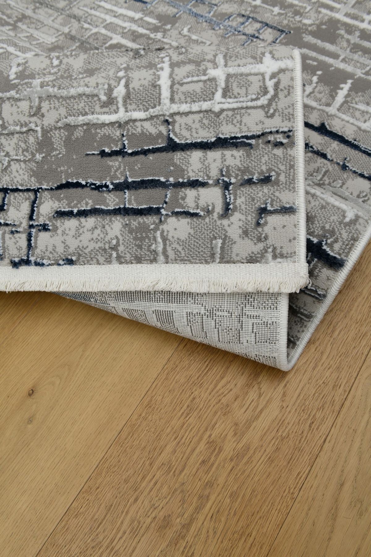 Astra GrafitBlå – Urban struktur i modern tappning